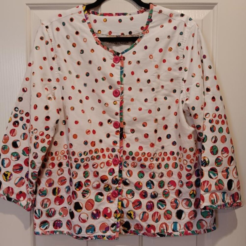 Lifestyle women's jacket size XL. White background w/ embellished colorful dots